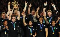 AUCKLAND, NEW ZEALAND - OCTOBER 23: Richie McCaw of the All Blacks lifts the Webb Ellis Cup as team mates celebrate after the 2011 IRB Rugby World Cup Final match between France and New Zealand at Eden Park on October 23, 2011 in Auckland, New Zealand. (Photo by Cameron Spencer/Getty Images)