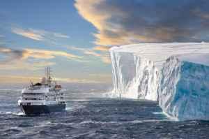 The cruise ship Corinthian II in front of a huge Iceberg in Antarctic Sound. Antarctic Sound is at the northern tip of the Antarctic Peninsular and connects the Southern Ocean to the Wedell Sea. Even in the summer months it is often filled with huge tabul