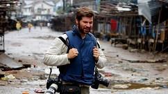 Handout photo of Getty Images photographer Chris Hondros walking through the streets in Liberia