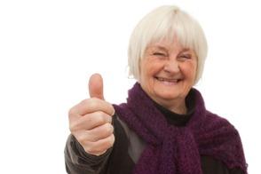 Success - older woman giving you the thumbs up