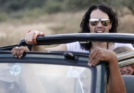 British actor Russell Brand is driven through the Ranthambhore National Park during a jungle safari in the Sawai Madhopur district in the desert Indian state of Rajasthan October 22, 2010. U.S. singer Katy Perry and Brand are apparently due to wed at the Aman-i-Khas luxury resort in Rajasthan on October 23, local media said. REUTERS/Adnan Abidi (INDIA - Tags: ENTERTAINMENT)