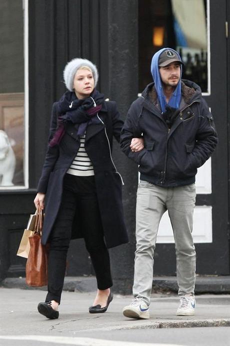 38195, NEW YORK, NEW YORK - Tuesday March 2, 2010. Shia Labeouf shares a tender kiss with girlfriend Carey Mulligan while strolling through NYC together. Shia is seen wearing a hooded sweatshirt and gray jeans (with what looks like a ripped pocket!) while his adorable Oscar-nominated girlfriend Carey opted for a furry beanie and navy blue coat. Carey is seen holding canvas handbag and a notebook in her brown paper bag. Photograph: PacificCoastNews.com