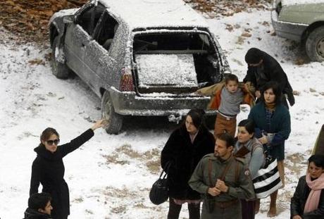 Actress Angelina Jolie (R) directs actors during the filming of her yet untitled directorial debut in Budapest November 8, 2010. Jolie is directing her first feature film about a Serbian man and Bosnian woman who meet on the eve of the 1992-95 Bosnian war. REUTERS/Laszlo Balogh (HUNGARY - Tags: ENTERTAINMENT)