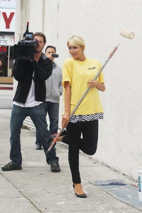 47693, LOS ANGELES, CALIFORNIA - Friday November 19, 2010. Paris Hilton, wearing a diamond Chanel necklace, arrives to do community service with the Hollywood Beautification Team. The socialite and heiress is seen trading her leather jacket and lowcut striped top for a standard yellow t-shirt featuring the organization's logo. Hilton helped other volunteers paint over graffiti found on the walls, some featuring graffiti with MS-13 markings, allegedly by the Mara Salvatrucha 13, gang. Hilton was being documented by several cameras throughout her community service work, and also never changed out of her off her black stiletto heels. She was seen several hours later signing a document that reportedly confirmed her community service hours. Before leaving, Hilton was assisted with putting on a band-aid on her finger. The heiress looked to be in good spirits after her day's work, not seeming to care that she had paint stains on her pants and heels! Photograph: Sam Sharma / Nate Jones,  PacificCoastNews.com