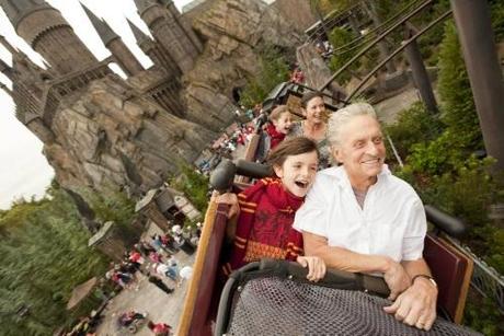 Academy award-winning actors Michael Douglas and wife Catherine Zeta-Jones, along with their children Dylan, 10, and Carys, 7, ride the Flight of the Hippogriff over The Wizarding World of Harry Potter and past Hogwarts Castle at Universal Orlando Resort November 27, 2010. Fans of the Harry Potter books and films, the family also sampled Butterbeer, got fitted for wands at Ollivanders and toured Hogwarts Castle while on vacation at Universal Orlando over the Thanksgiving holiday.  REUTERS/Universal Orlando Resort/Matt Stroshane/Handout (UNITED STATES - Tags: ENTERTAINMENT) NO SALES. FOR EDITORIAL USE ONLY. NOT FOR SALE FOR MARKETING OR ADVERTISING CAMPAIGNS. THIS IMAGE HAS BEEN SUPPLIED BY A THIRD PARTY. IT IS DISTRIBUTED, EXACTLY AS RECEIVED BY REUTERS, AS A SERVICE TO CLIENTS