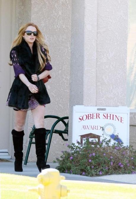 47990, PALM DESERT, CALIFORNIA - Monday November 29, 2010. AND THE AWARD GOES TO: Lindsay Lohan leaves her Palm Desert outpatient home with a visible 'Sober Shine Award' placard placed in her front yard. The sign was placed last night in front of Lohan's home. Lohan, who is currently undergoing court ordered rehab at The Betty Ford Clinic, is reportedly being replaced by actress Malin Akerman in the upcoming Linda Lovelace biopic Inferno . She was spotted over the weekend doing a bit of retail shopping, stopping at a jewelry store at an outlet near Palm Springs, followed by a Prada store. Photograph:  David Tonnessen, PacificCoastNews.com