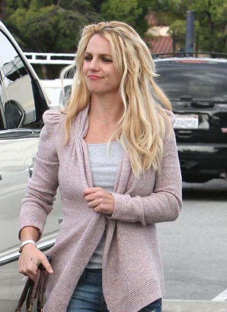 Singer Britney Spears leaves the boys behind and bares the dreary rain to go shopping and do a quick outfit change with her favorite bodyguard in Santa Monica, Ca on October 6, 2010. Fame Pictures, Inc