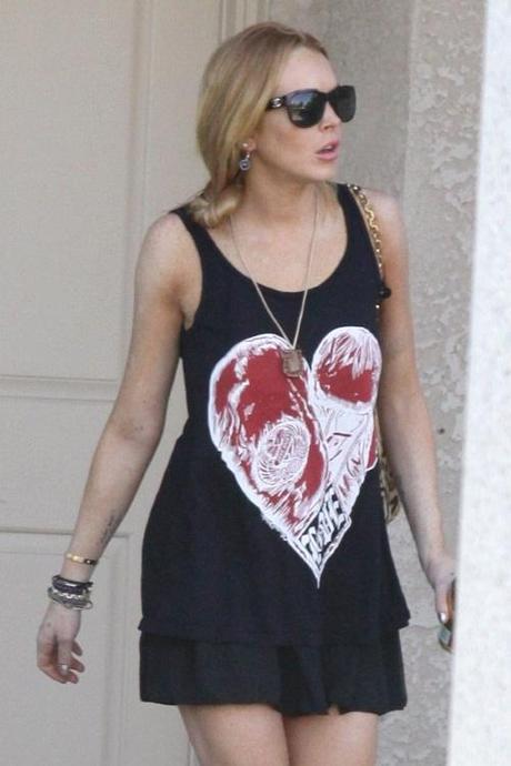48448, PALM DESERT, CALIFORNIA - Saturday December 11 2010. Lindsay Lohan wears her heart on her sleeve, leaving her house with a heart design on her dress. The actress was on her way to class at The Betty Ford Clinic, where she is currently undergoing treatment. Photograph:  David Tonnessen, PacificCoastNews.com
