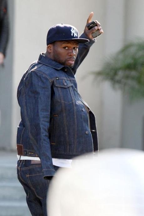 47301, LOS ANGELES, CALIFORNIA - Wednesday November 10, 2010. An injured 50 Cent makes a visit to Chelsea Handler's talkshow Chelsea Lately , whom he has recently been romantically linked to. The rapper couldn't keep off his Blackberry phone as he left the TV studio, wearing a baseball cap and a full on denim outfit. 50 Cent recently took part in a hilarious spook video (which was later aired on Chelsea Lately ) featured 15-year-old internet singing sensation Keenan Cahill. Photograph: Pedro Andrade,  PacificCoastNews.com