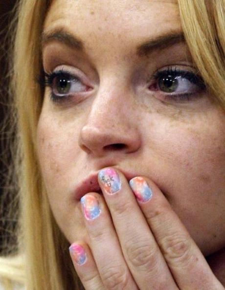 Hollywood starlet Lindsay Lohan has an expletive written on her middle finger during a probation status hearing at the Beverly Hills Municipal Courthouse, in Beverly Hills, California on July 6, 2010.   UPI/David McNew/Pool Photo via Newscom