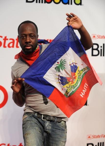 SAN JUAN, PUERTO RICO - APRIL 29: Musician Wyclef Jean holds a Haitian flag at the 2010 Billboard Latin Music Awards at Coliseo de Puerto Rico Jos Miguel Agrelot on April 29, 2010 in San Juan, Puerto Rico. (Photo by Gustavo Caballero/Getty Images)