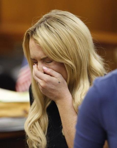 Actress Lindsay Lohan sneezes while appearing in court during a probation status hearing relating to her August 2007 no contest pleas to two counts each of DUI and being under the influence of cocaine, along with a reckless driving charge, at the Beverly Hills Municipal Courthouse, in Beverly Hills, California on July 6, 2010.   UPI/David McNew/Pool Photo via Newscom