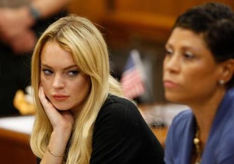 LOS ANGELES, CA - JULY 06: Actress Lindsay Lohan (L) and lawyer Shawn Chapman Holley attend a probation revocation hearing at the Beverly Hills Courthouse on July 6, 2010 in Los Angeles, California. Lindsay Lohan was put on probation for her August 2007 no-contest plea to drug and alcohol charges stemming from two separate traffic accidents, but the probation was revoked in May 2010 after missing a scheduled hearing. (Photo by David McNew/Getty Images)