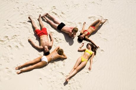People sunbathing in the sand