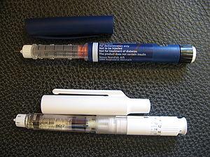 Two types of modern, pre-filled insulin syringes.