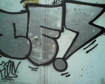 Das Sprühen von Graffiti auf Wänden