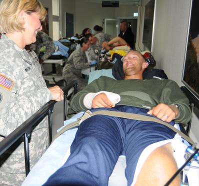 Major General Patricia McQuistion visits a Wounded Warrior