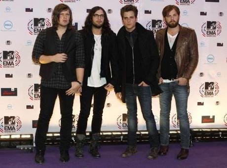 Members of the U.S. band Kings of Leon (L-R) Matthew Followill, Nathan Followill, Jared Followill and Caleb Followill pose for photographers as they arrive for the MTV Europe Music Awards 2010 in Madrid November 7, 2010. REUTERS/Susana Vera  (SPAIN - Tags: ENTERTAINMENT PROFILE)