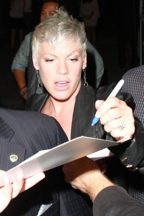 44112, HOLLYWOOD, CALIFORNIA - Saturday August 28 2010. P!nk flashes her wedding and engagement rings as she signs autographs for fans at the Art of Elysium event in Hollywood. The singer, real name Alecia Moore, was accompanied to the event by her reconciled husband Corey Hart. P!nk was one of hundreds of celebrities attending the pre-Emmys fundraiser, which encourages actors, artists and musicians to donate their time and talent who are battling serious medical conditions. Photograph:  Greg Tidwell, PacificCoastNews.com
