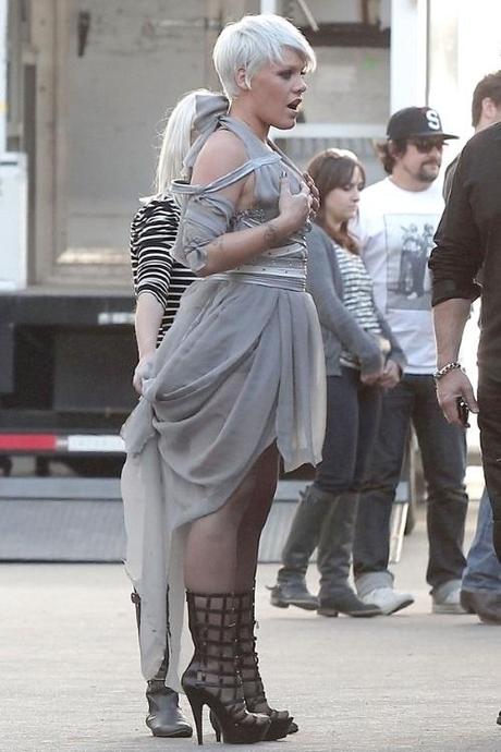48112, LOS ANGELES CALIFORNIA - Thursday December 2, 2010. With signs of gaining weight, a pregnant Pink is spotted on the Downtown Los Angeles set of her music video. Pink, wearing a low cut grey dress and strappy high heels, is expecting her first child with husband Carey Hart. Photograph:  PacificCoastNews.com