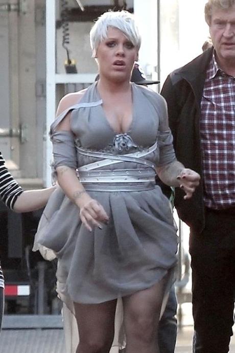 48112, LOS ANGELES CALIFORNIA - Thursday December 2, 2010. With signs of gaining weight, a pregnant Pink is spotted on the Downtown Los Angeles set of her music video. Pink, wearing a low cut grey dress and strappy high heels, is expecting her first child with husband Carey Hart. Photograph:  PacificCoastNews.com
