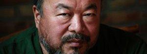 Dissedent Chinese artist Ai Weiwei reacts during a group interview at his studio in Beijing