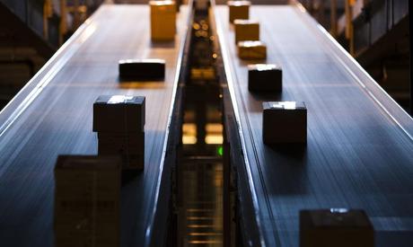 Parcels travel on a conveyer belt before being sorted for delivery in one of the three main Swiss post logistic hubs in Daillens near Lausanne