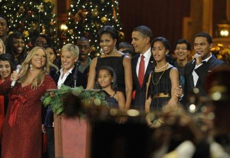 U.S. President Barack Obama and First Lady Michelle Obama, with daughters Sasha and Malia, take part in the conclusion of a Christmas In Washington celebration, with entertainers (L-R) Mariah Carey, Ellen DeGeneres and Maxwell, at the Building Museum in Washington, DC on December 12, 2010. The event was being taped for later broadcast on TV.  UPI/Mike Theiler/Pool Photo via Newscom