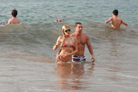 48760, MAUI, HAWAII - Thursday December 23 2010. Paris Hilton and boyfriend Cy Waits frolic around in the waves on Maui beach. The couple are spending Christmas in Hawaii with Paris's parents Kathy and Rick, her sister Nicky and Nicky's boyfriend David Katzenberg. Photograph: PacificCoastNews.com
