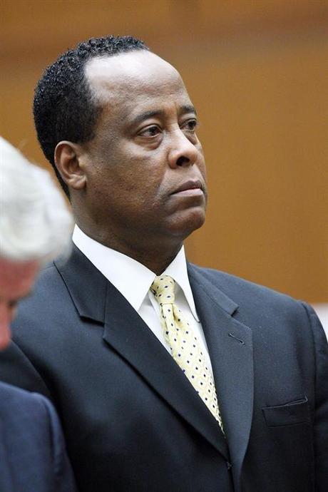 39203, LOS ANGELES, CALIFORNIA - Monday April 5, 2010. Dr. Conrad Murray stands near defense attorney John Michael Flanagan as he appears at Los Angeles Superior Court in Los Angeles. Murray is charged with involuntary manslaughter in connection with the death of pop singer Michael Jackson. The doctor was personal physician to Jackson when he died from an overdose of a powerful prescription sedative at the age of 50 on June 25, 2009. Photograph: PacificCoastNews.com