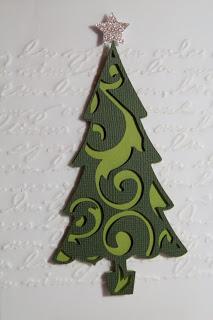 Die Weihnachtskarte mit dem verschnörkelten Baum...