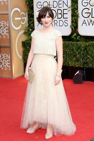 Zooey Deschanel, in Oscar de la Renta, with Fred Leighton jewels and a Charlotte Olympia clutch.