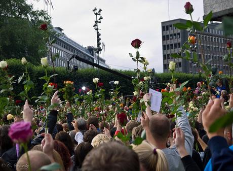 About 150 000 people gathered in central Oslo for a 'rose march' around the centre of Oslo. (We were supposed to march in the streets, but so many showed up that it was not possible.) The demonstration was in defiance and protest at the bombing and shooting on Friday 22 July 2011. Crowds held roses in the air.